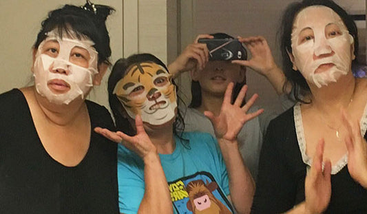 four women doing at-home-spa masks